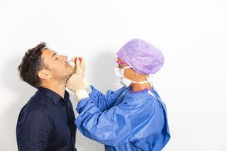 Doctor taking a nasal swab test